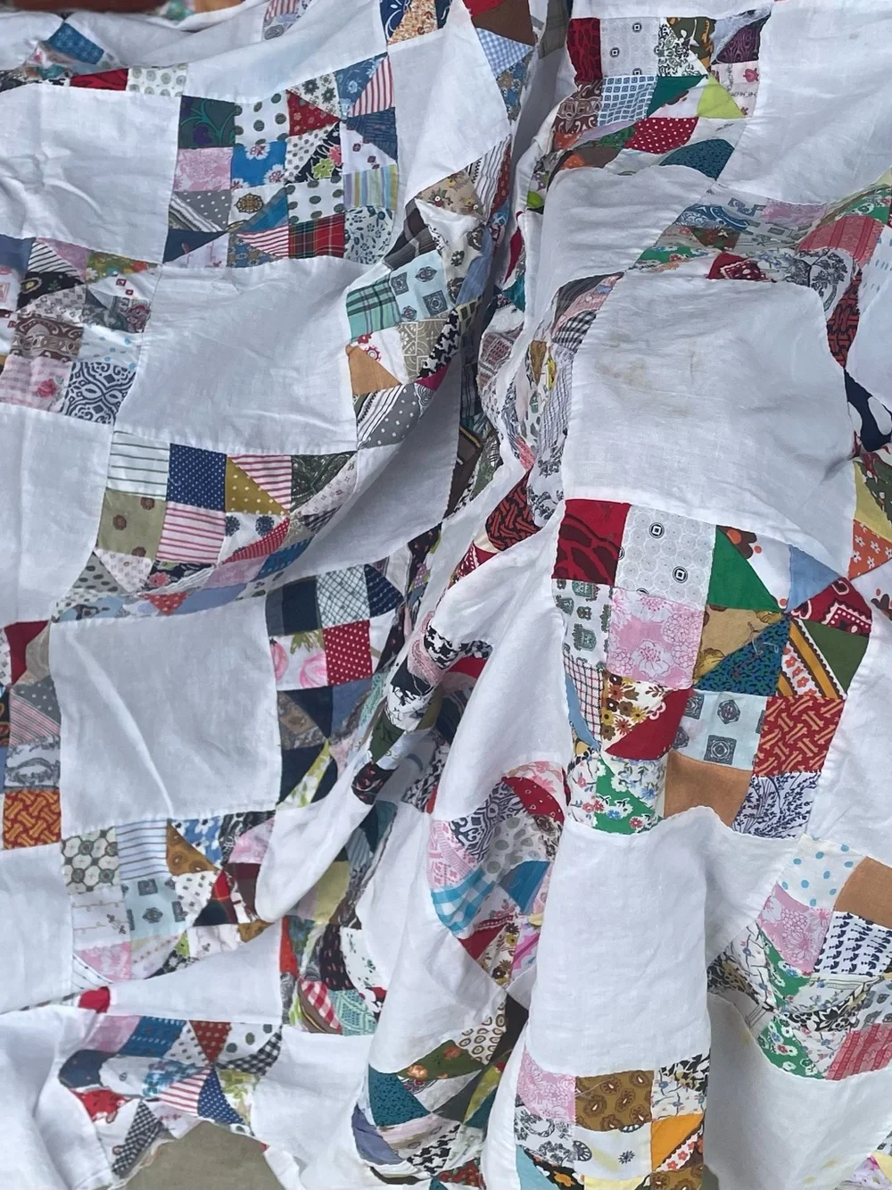 Handmade Hand stitched  White Patchwork Quilt with Multicolored Squares.